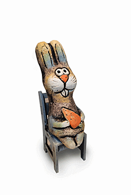 Заяц с морковкой на стуле 